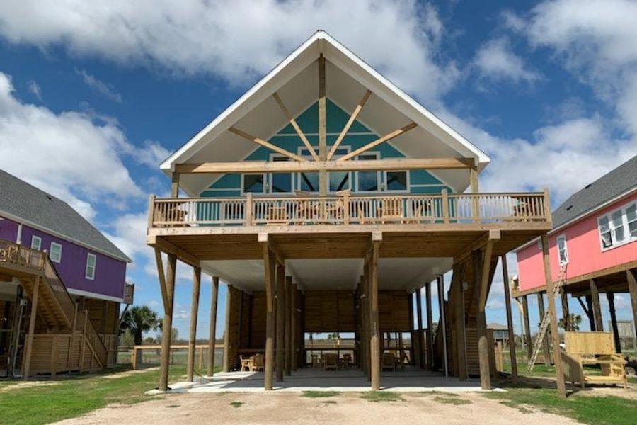 gun barrel pilings beach home walz family builders and manley